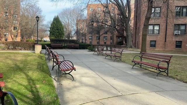 view of community featuring a patio and a lawn