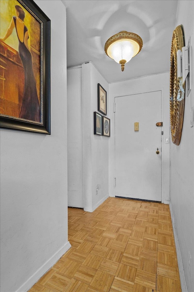 corridor with light parquet floors