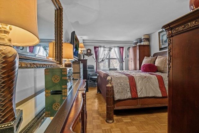 bedroom with light parquet flooring