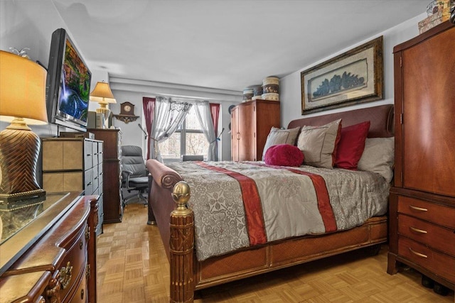 bedroom featuring light parquet flooring