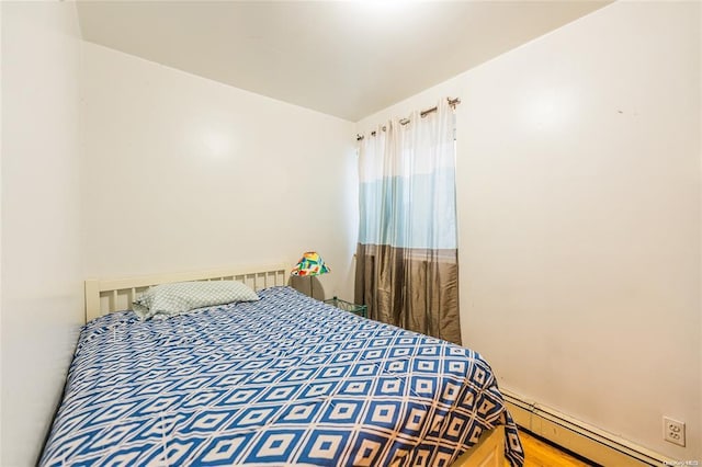 bedroom featuring a baseboard radiator