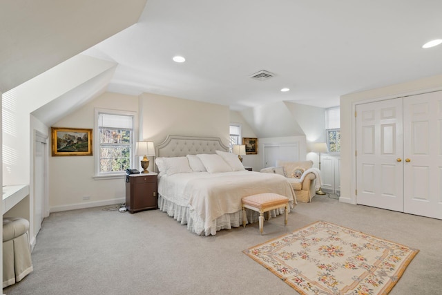 8 Stonegate Ln, Old Brookville, NY 11545 - bedroom with light colored carpet, lofted ceiling, multiple windows, recessed lighting, and baseboards