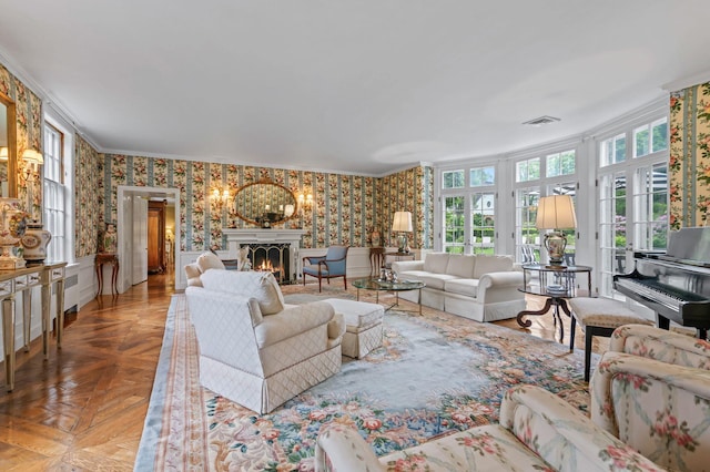 8 Stonegate Ln, Old Brookville, NY 11545 - living room with wallpapered walls, ornamental molding, a lit fireplace, a wainscoted wall, and a chandelier