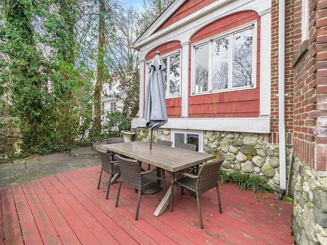 wooden deck with outdoor dining space