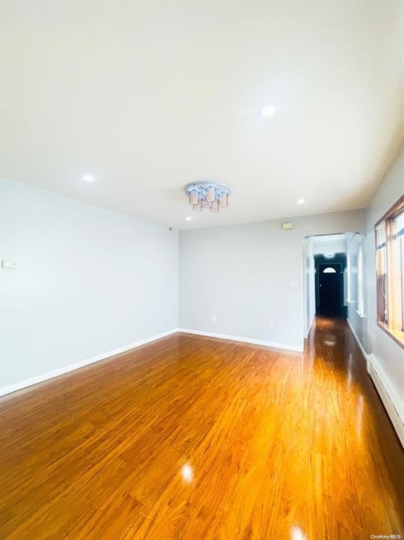 unfurnished living room with wood-type flooring