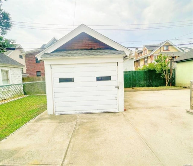 garage featuring a yard