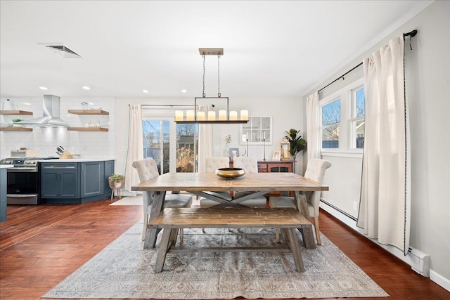 dining room featuring visible vents, dark wood-type flooring, and recessed lighting