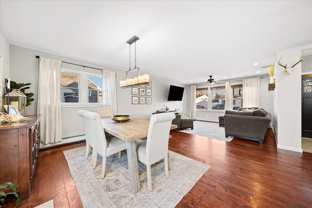 dining area featuring a wealth of natural light, baseboards, dark wood-type flooring, and recessed lighting