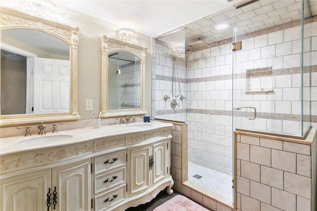 bathroom featuring vanity and a shower with shower door