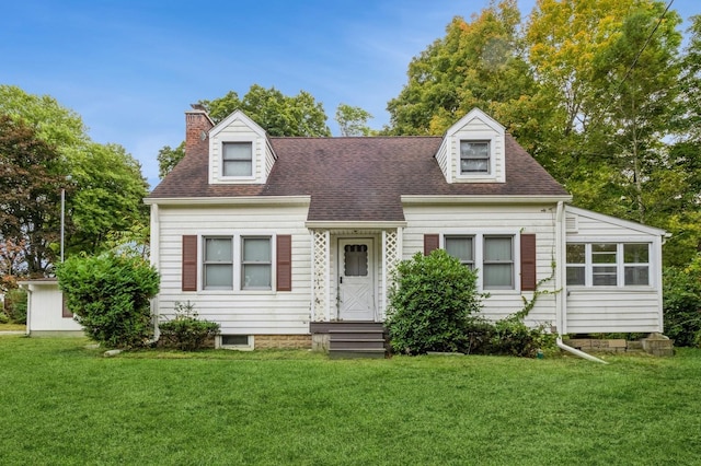 cape cod home with a front lawn