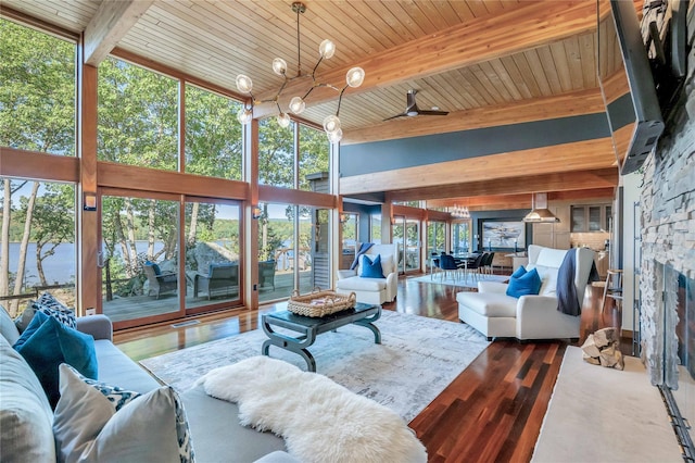 living room with wooden ceiling, floor to ceiling windows, beam ceiling, and wood finished floors