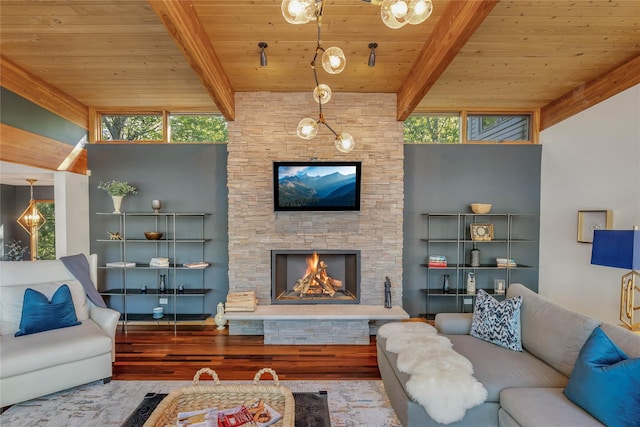 living area with beam ceiling, wooden ceiling, a fireplace, and light wood finished floors