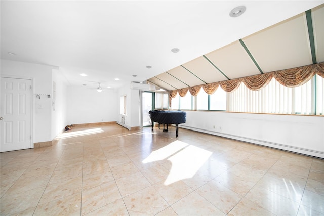 interior space with light tile patterned flooring, ceiling fan, and a baseboard heating unit