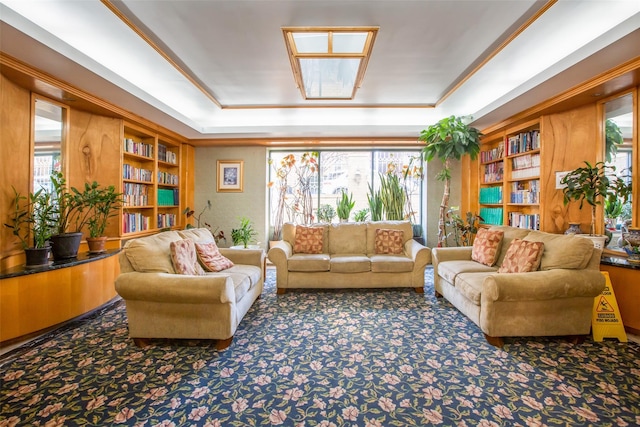 living room with a raised ceiling, plenty of natural light, and carpet floors