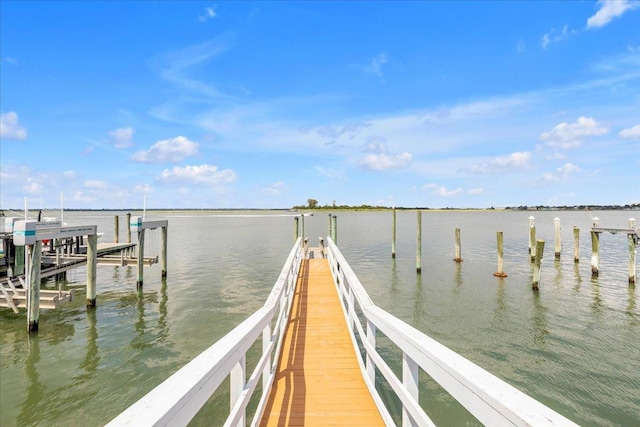 dock area featuring a water view and boat lift