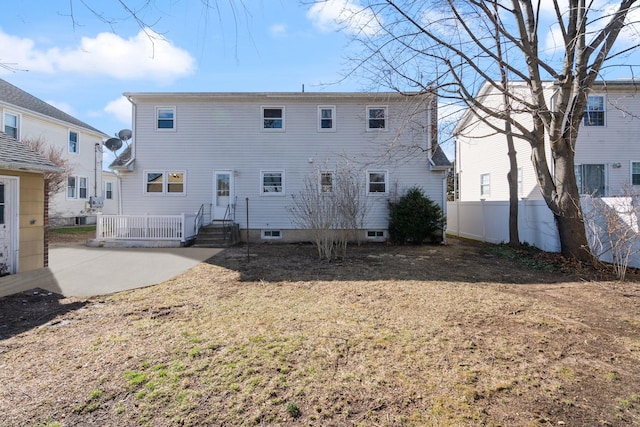 back of house with a patio area and fence