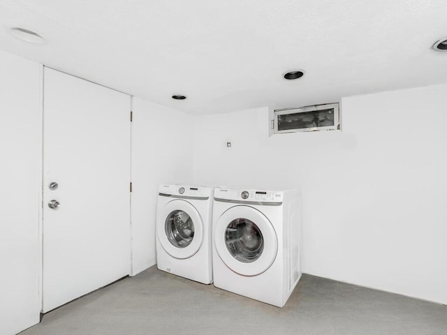 clothes washing area with laundry area and washing machine and clothes dryer