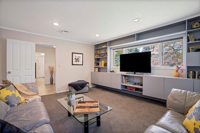 living room with carpet, visible vents, built in shelves, ornamental molding, and recessed lighting