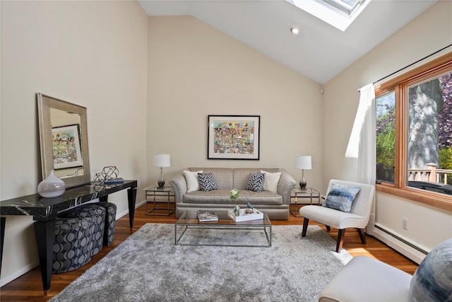 living room with baseboards, baseboard heating, high vaulted ceiling, and a skylight