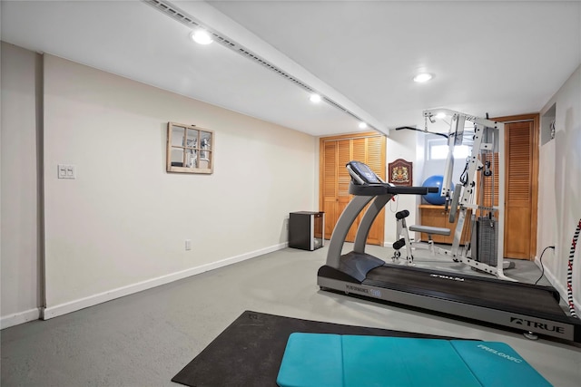 exercise room with baseboards
