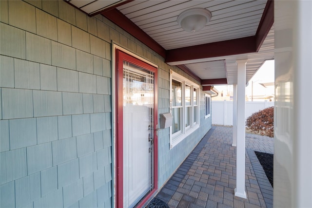 exterior space with covered porch and fence