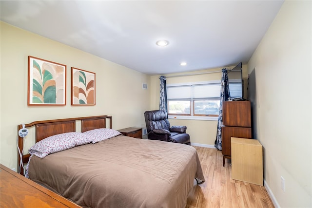 bedroom featuring recessed lighting, baseboards, and light wood finished floors