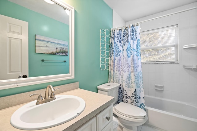 full bathroom featuring toilet, vanity, and shower / tub combo