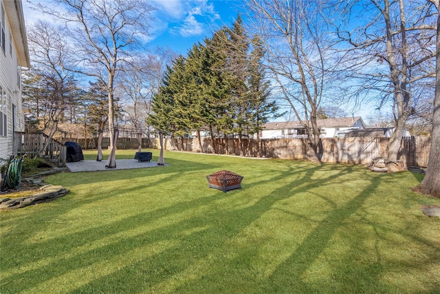 view of yard with an outdoor fire pit