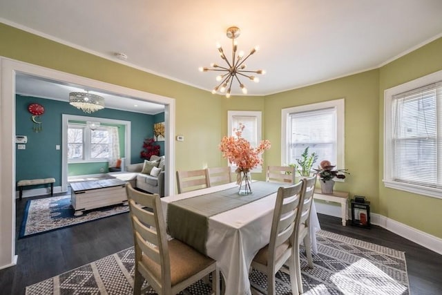 dining room featuring crown molding, an inviting chandelier, and dark hardwood / wood-style flooring