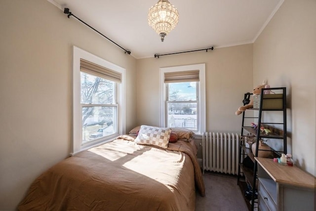 bedroom featuring multiple windows, ornamental molding, carpet flooring, and radiator heating unit