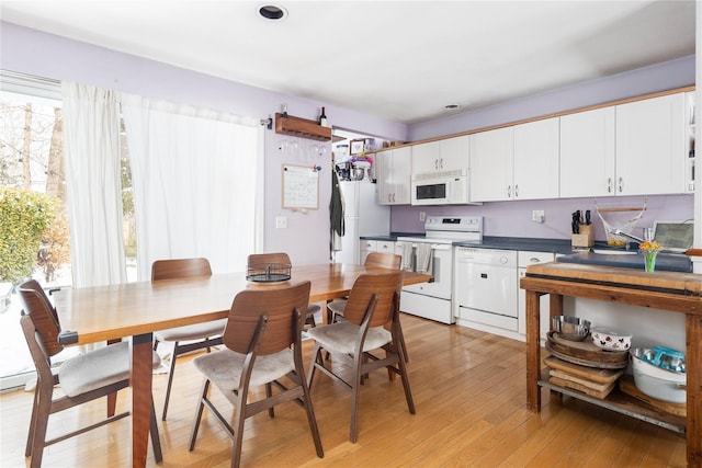 dining space featuring light hardwood / wood-style flooring