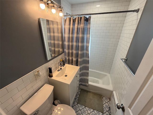 full bathroom featuring vanity, tile walls, toilet, and shower / bath combination with curtain