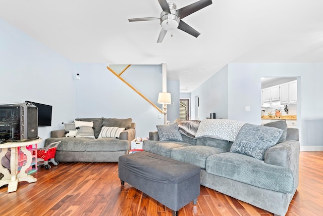 living area with ceiling fan and wood finished floors