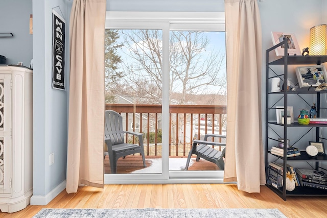 entryway featuring light wood-style floors and baseboards