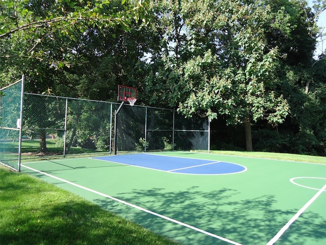 view of sport court featuring community basketball court and fence