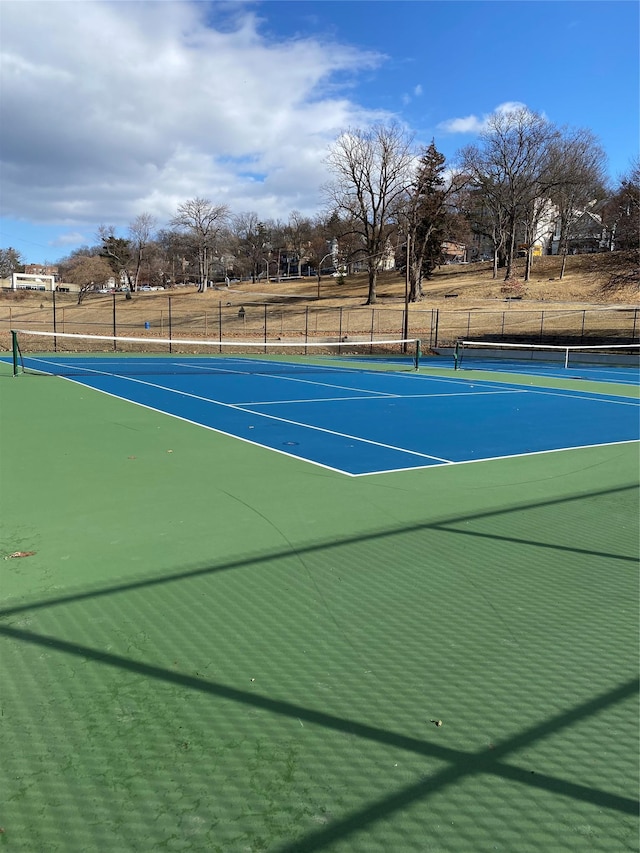 view of sport court with fence