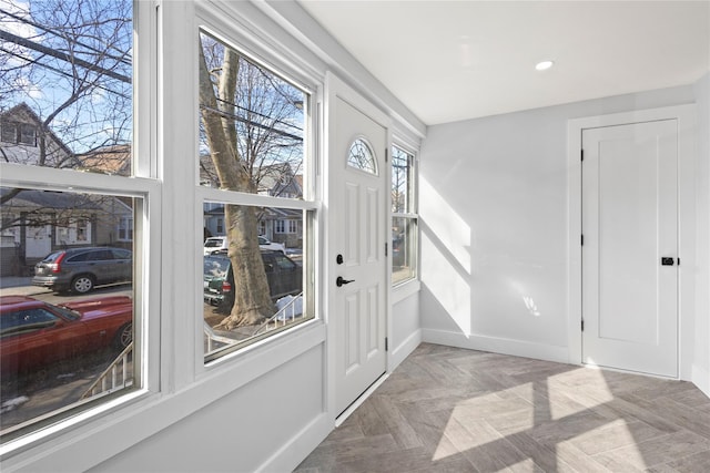 entryway featuring recessed lighting and baseboards