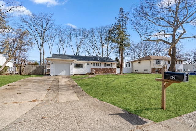 ranch-style house with a garage, brick siding, fence, driveway, and a front yard