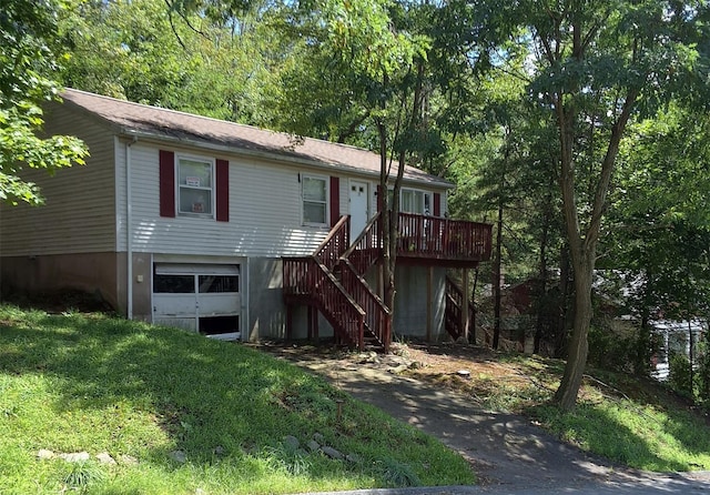 view of front of property with a garage and stairs