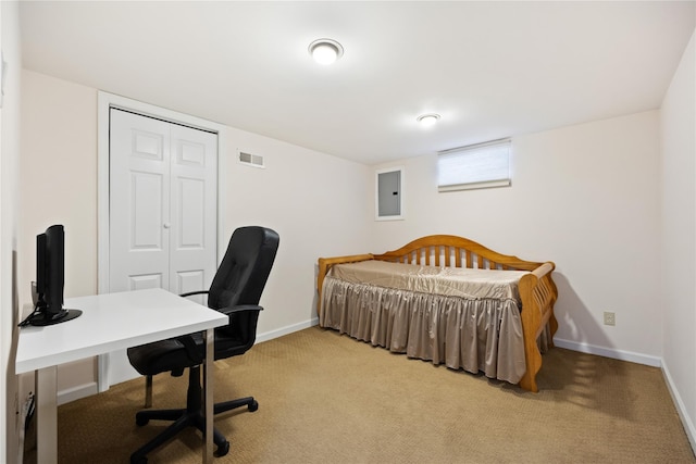 bedroom featuring baseboards, light colored carpet, visible vents, and electric panel