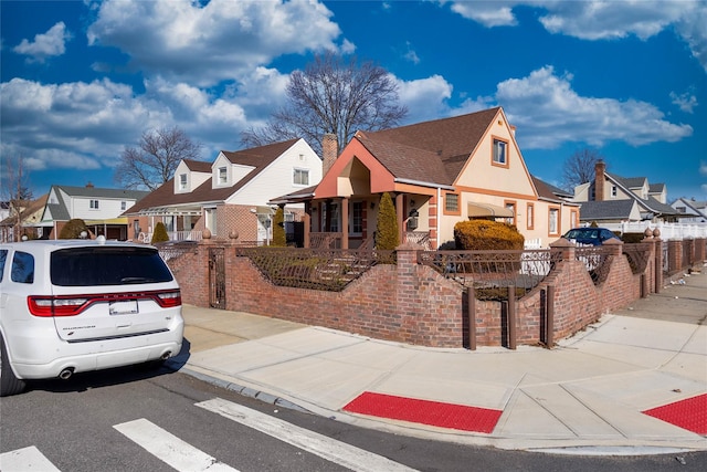 view of front of house with a fenced front yard and a residential view