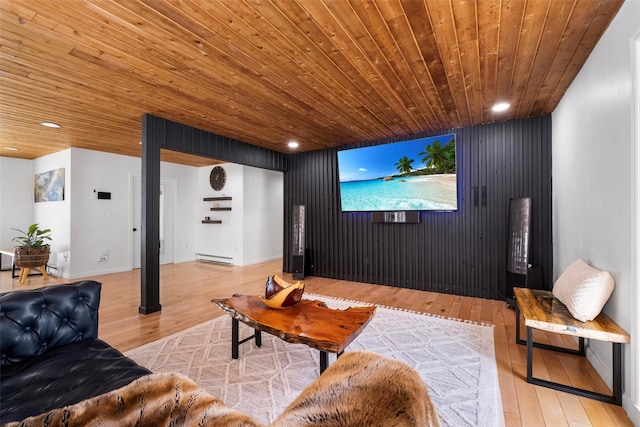 home theater with a baseboard radiator, wooden ceiling, light wood-style flooring, and recessed lighting