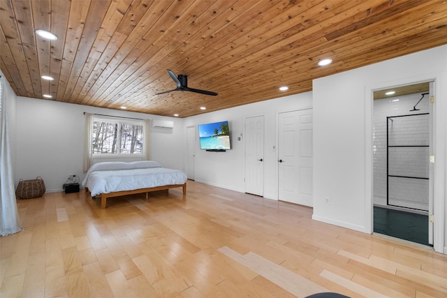 unfurnished bedroom with a wall unit AC, light wood finished floors, recessed lighting, ensuite bath, and wooden ceiling