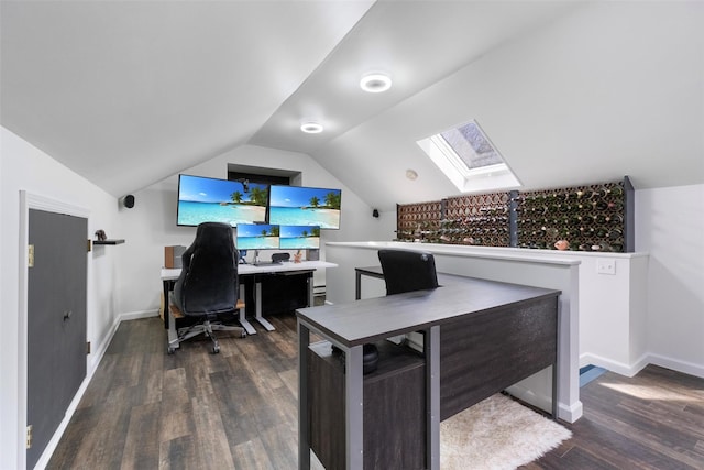 home office with lofted ceiling with skylight, wood finished floors, and baseboards