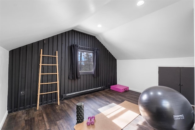 exercise area with dark wood-type flooring, lofted ceiling, baseboards, and baseboard heating