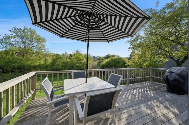 wooden deck featuring grilling area