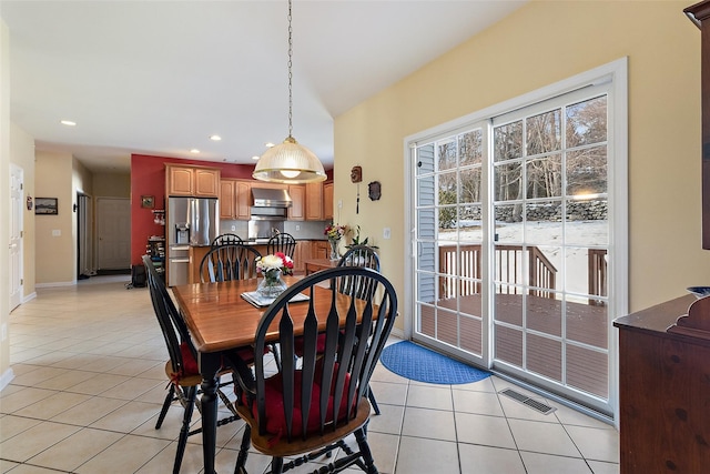 dining space featuring light tile patterned floors, recessed lighting, and baseboards