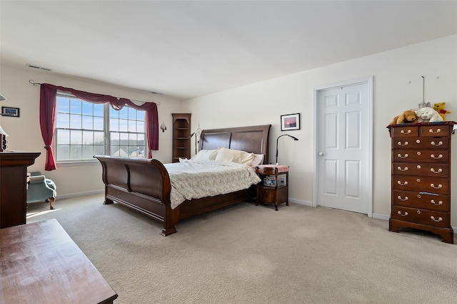 bedroom featuring carpet floors and baseboards