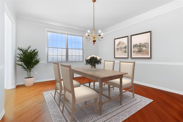 28 Teal Ln, Brewster, NY 10509 - dining room featuring a chandelier, wood finished floors, baseboards, and ornamental molding