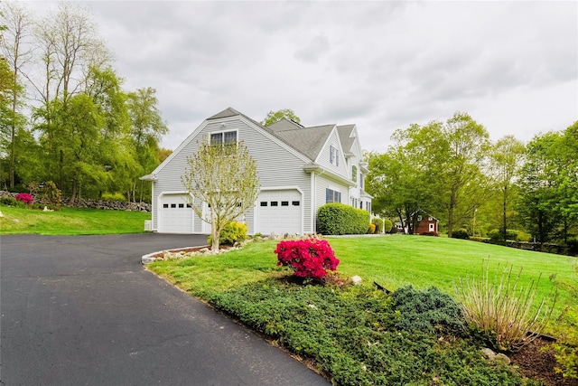 28 Teal Ln, Brewster, NY 10509 - view of front of property with a front lawn and asphalt driveway